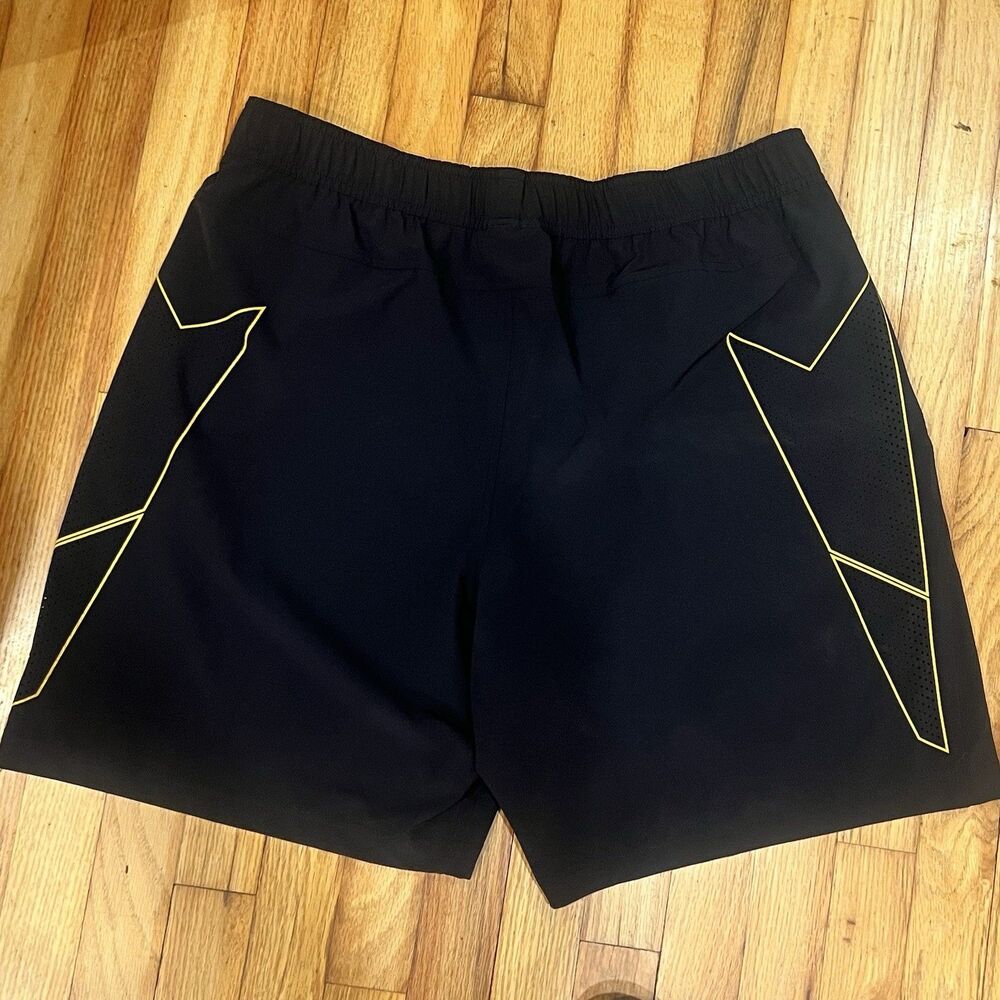 These are the Under Armour Men's Project Rock Woven Training Shorts